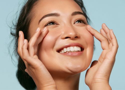 Happy young woman after facial reconstruction surgery