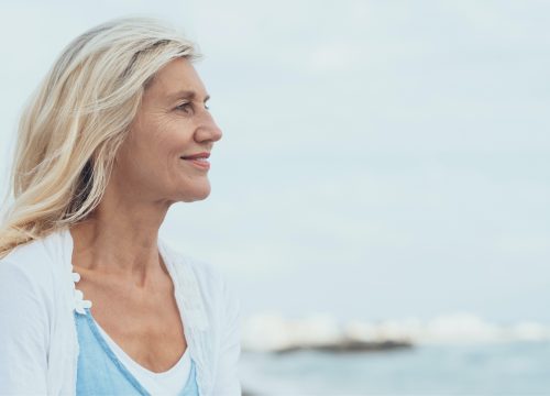 Older woman with a sculpted chin after Kybella treatments