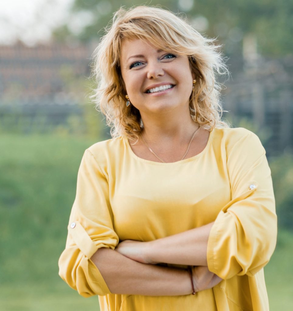 Blonde woman in a yellow blouse