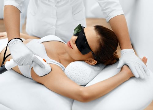 woman getting laser hair removal treatment